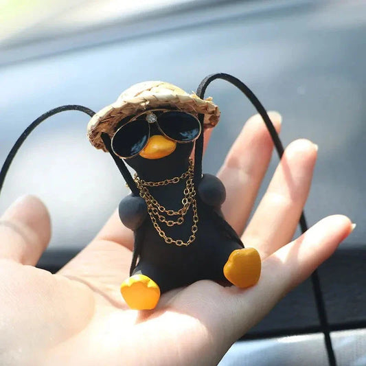Charming swinging duck car accessory with guitar and coke-themed design, offering a unique and personalized driving experience