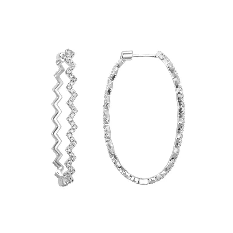 A pair of elegant sterling silver geometric earrings with a captivating wave-like pattern, inspired by the latest fashion trends in Japan and South Korea.