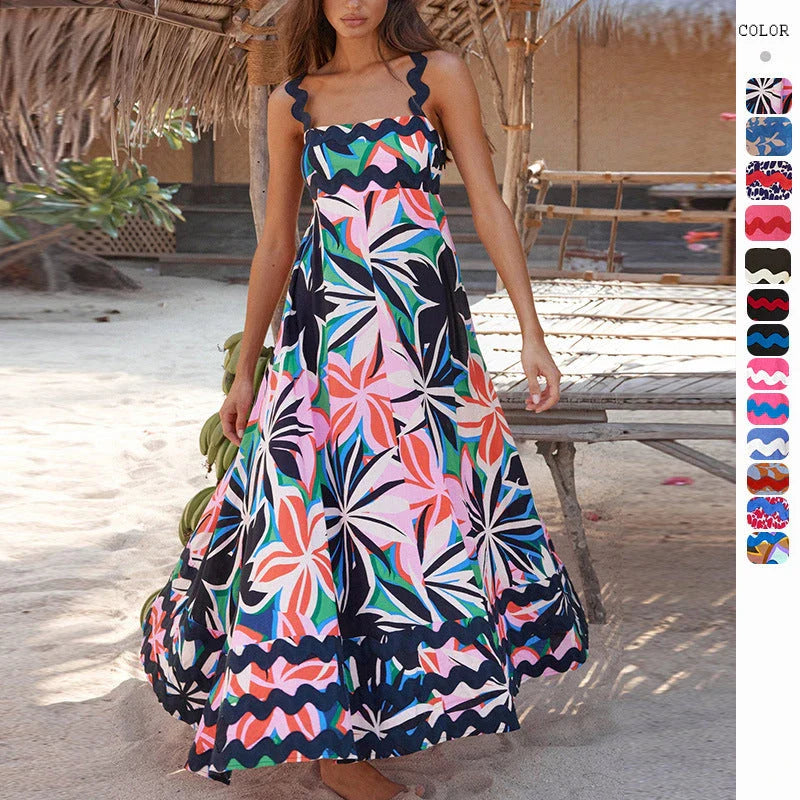 Elegant floral print suspender midi dress in black, perfect for summer beach holidays in the UK