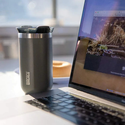 Premium insulated stainless steel travel mug in various vibrant colours, designed for keeping hot and cold drinks at the perfect temperature for on-the-go British lifestyles.