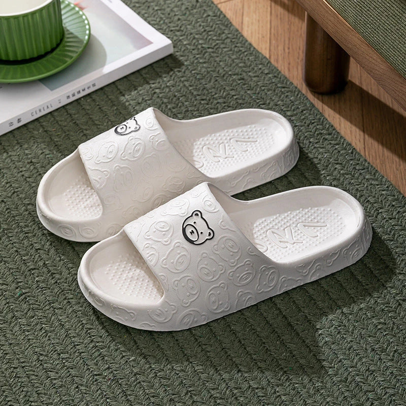 Cosy bear paw slippers in purple colour with soft, plush lining for relaxing indoor wear