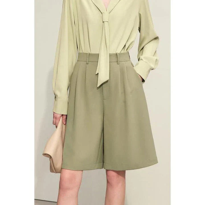 Elegant wide-leg shirred shorts in deep blue, designed for the modern British woman