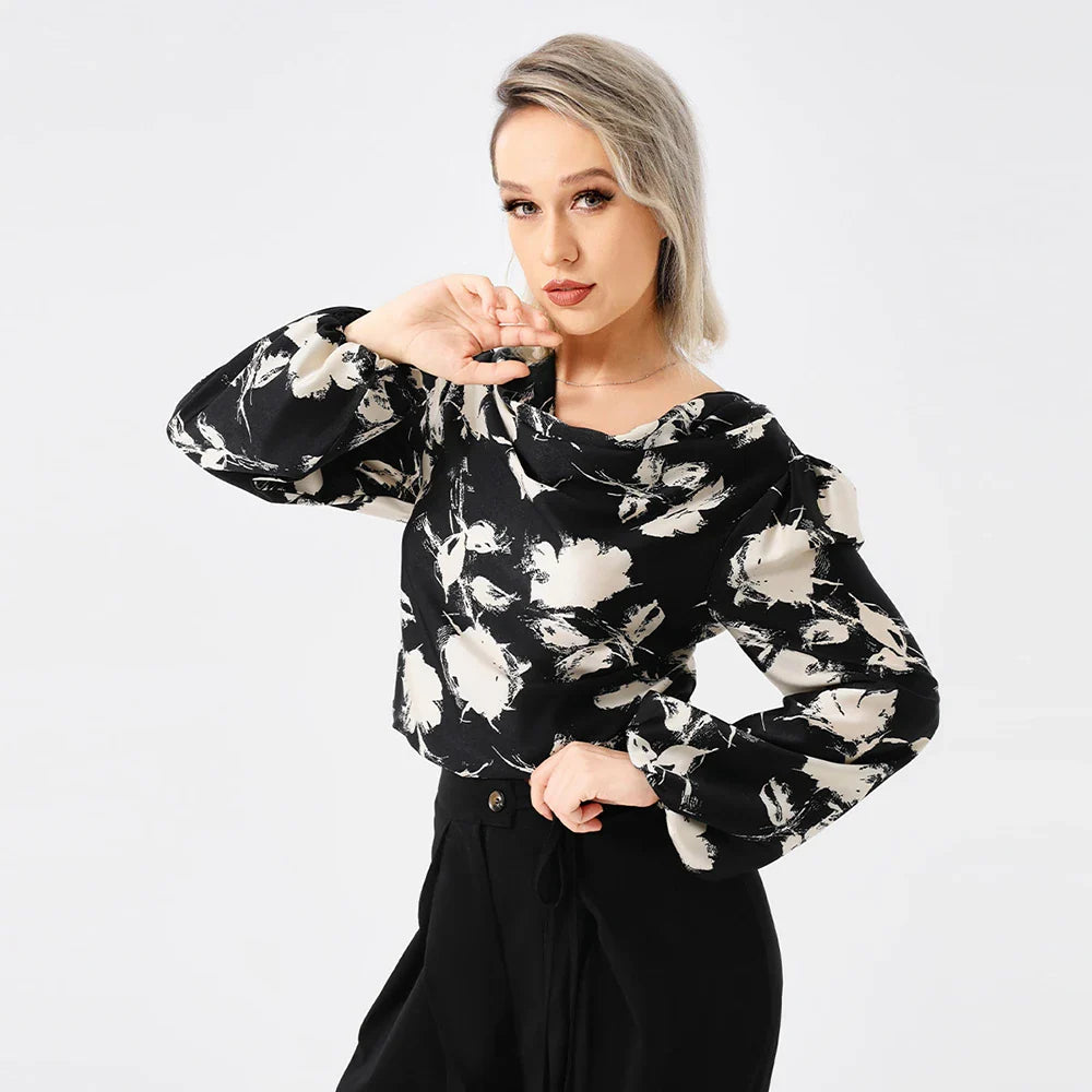 Elegant ladies' blouse with a printed pattern, dropped collar, and long sleeves in a classic white colour