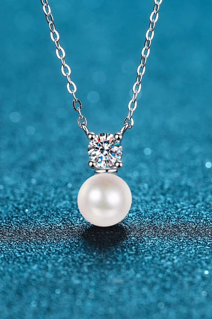 925 sterling silver necklace featuring freshwater pearls and a moissanite centre stone, a stunning piece of British-inspired jewellery