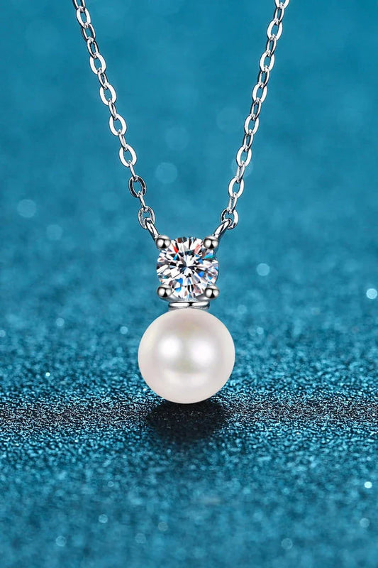925 sterling silver necklace featuring freshwater pearls and a moissanite centre stone, a stunning piece of British-inspired jewellery