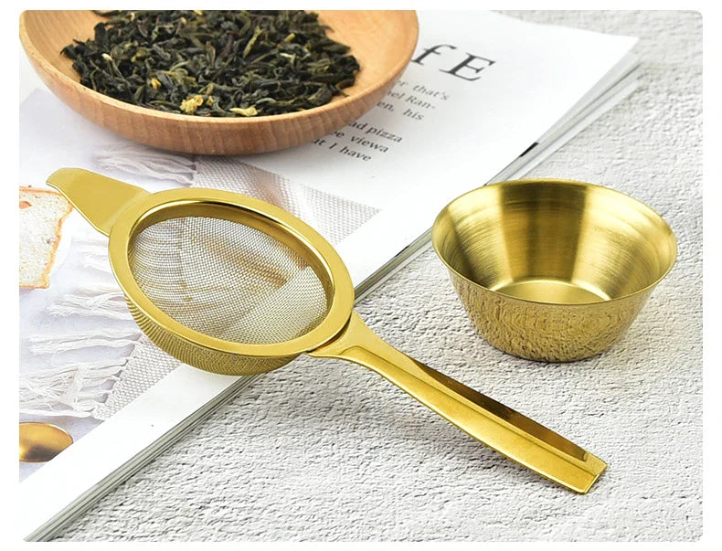 Stainless steel tea infusers with gold-tone finish in a modern, minimalist design