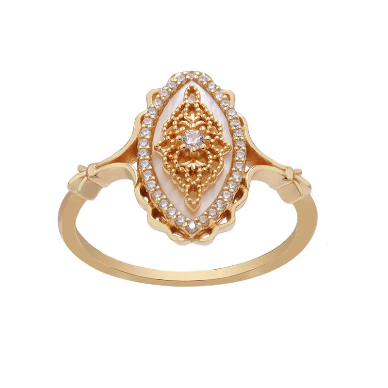 Elegant vintage-style natural white shell ring with silver construction, available in sizes 5 to 8