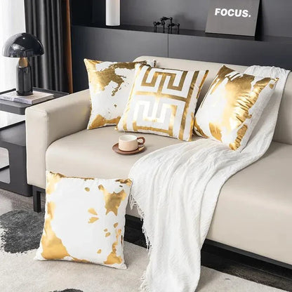 Pair of Nordic-inspired geometric plush pillowcases with a luxurious gold pattern on a white and black background