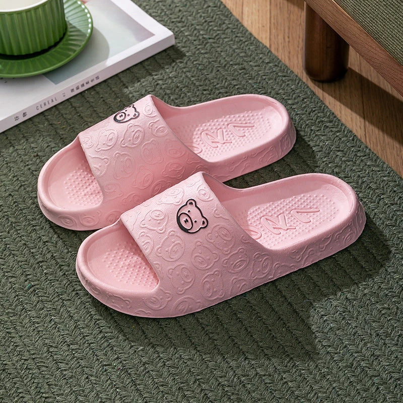 Cosy bear paw slippers in purple colour with soft, plush lining for relaxing indoor wear