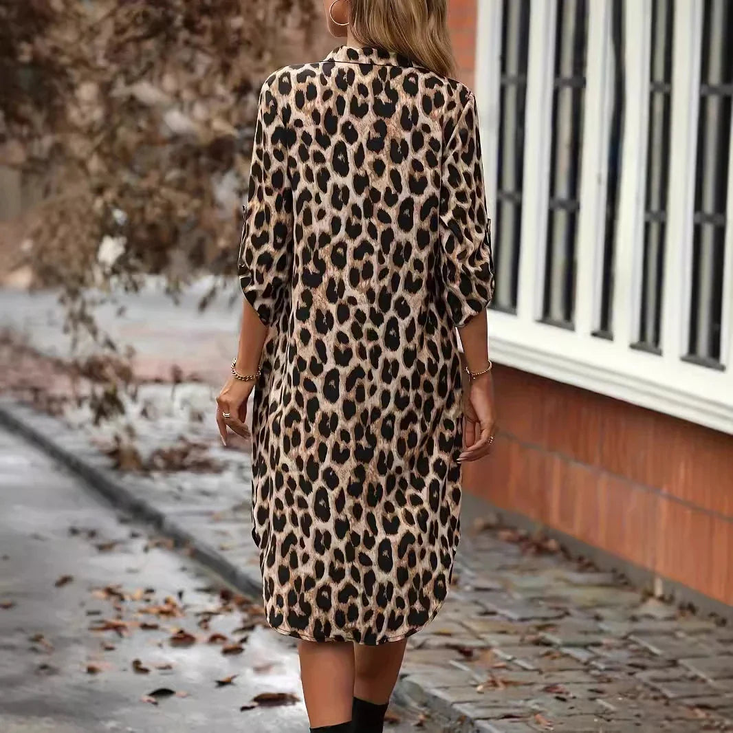 Elegant leopard print beach cover-up dress with A-line silhouette, loose waist, and pockets for comfortable and stylish holiday wear
