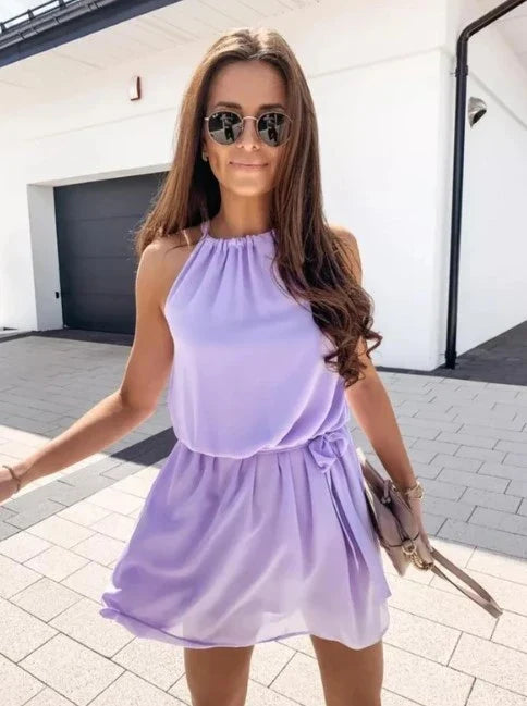 Elegant chiffon beach dress with neck tie in black and light purple colours, perfect for British coastal style