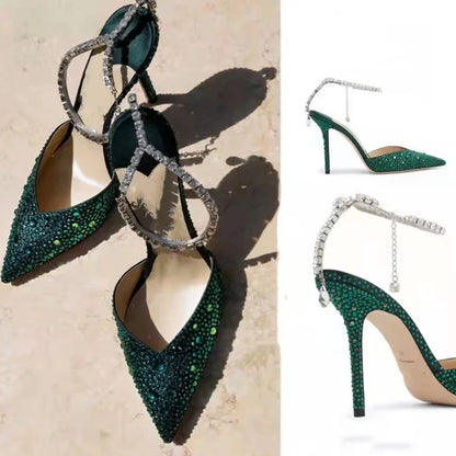 Elegant stiletto sandals with rhinestone chain embellishment, showcasing a sleek pointed toe design and matte finish for a sophisticated British-inspired look.