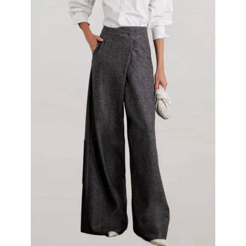 Elegant woollen wide-leg trousers in a high-waist design with unique asymmetric detailing, perfect for the discerning British woman.