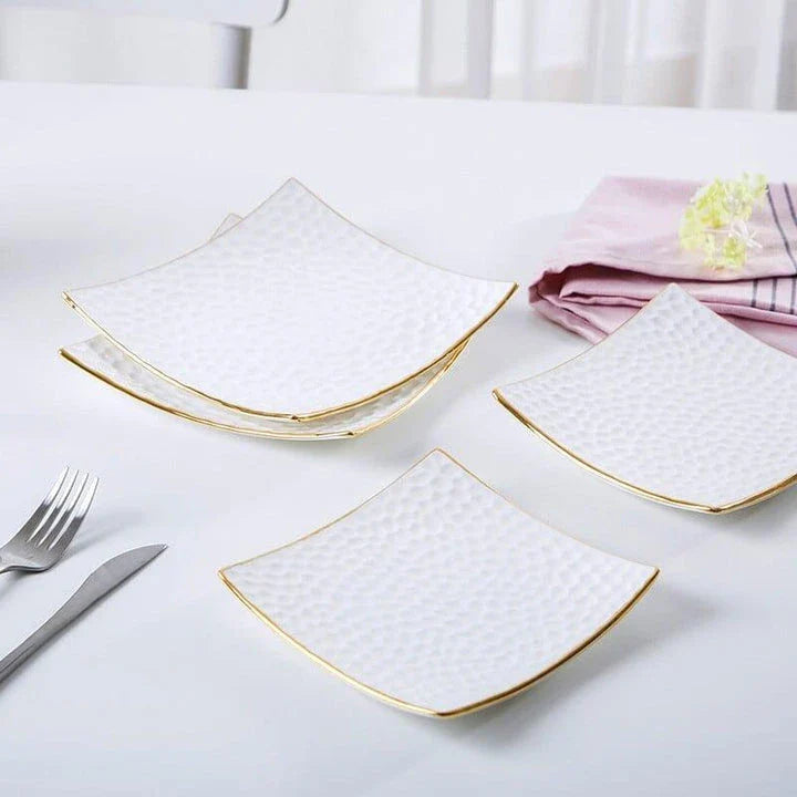 Elegant embossed ceramic cake plate in white color, perfect for serving cakes and pastries during afternoon tea