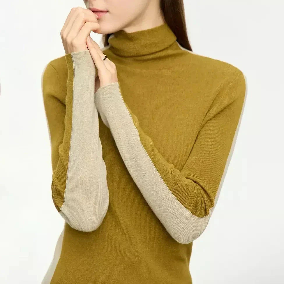 A cosy and stylish turtleneck sweater with a unique patchwork design, made from a premium wool blend for exceptional comfort and elegance.
