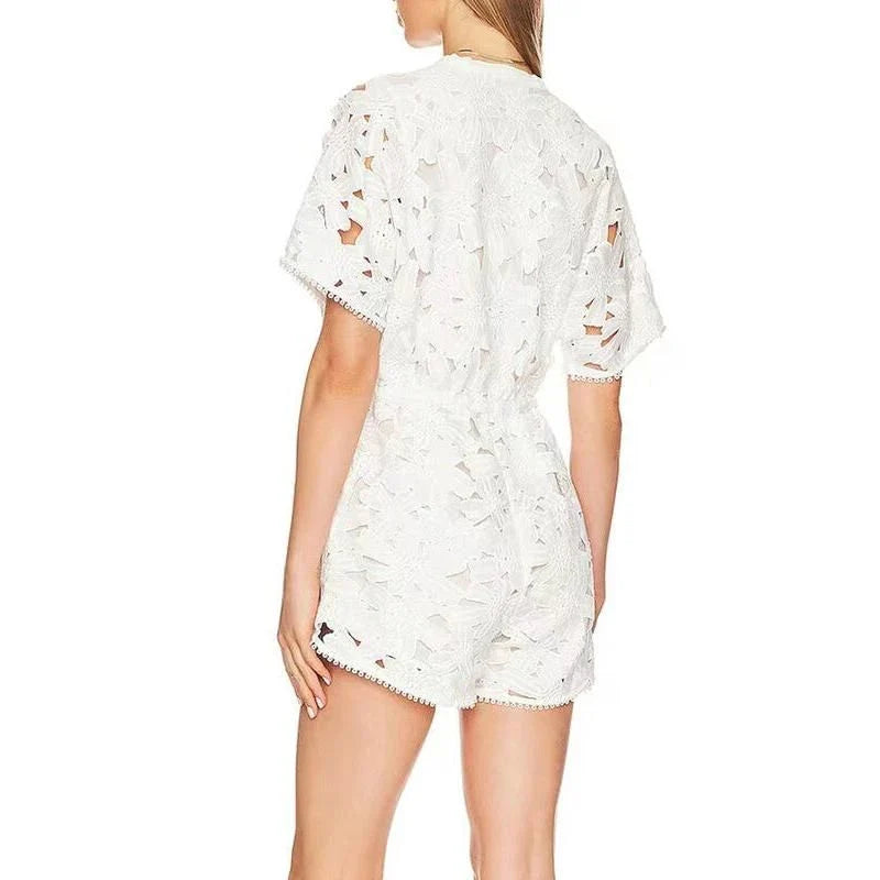 Elegant embroidered playsuit with hollow-out details, perfect for British summer style