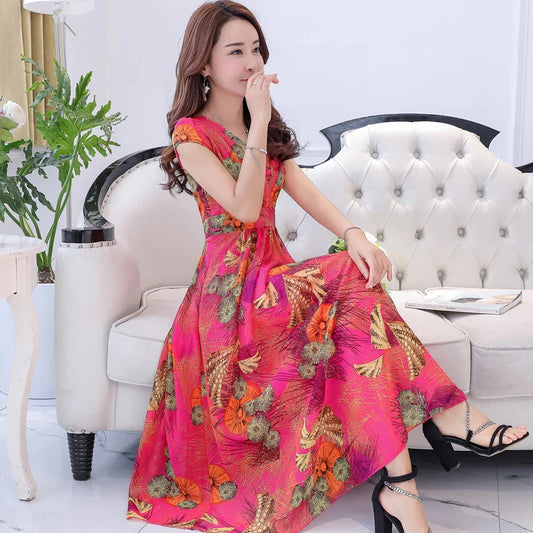 A graceful chiffon dress with short sleeves and a floor-sweeping hem, featuring a delicate printed pattern for a sophisticated, elegant look.