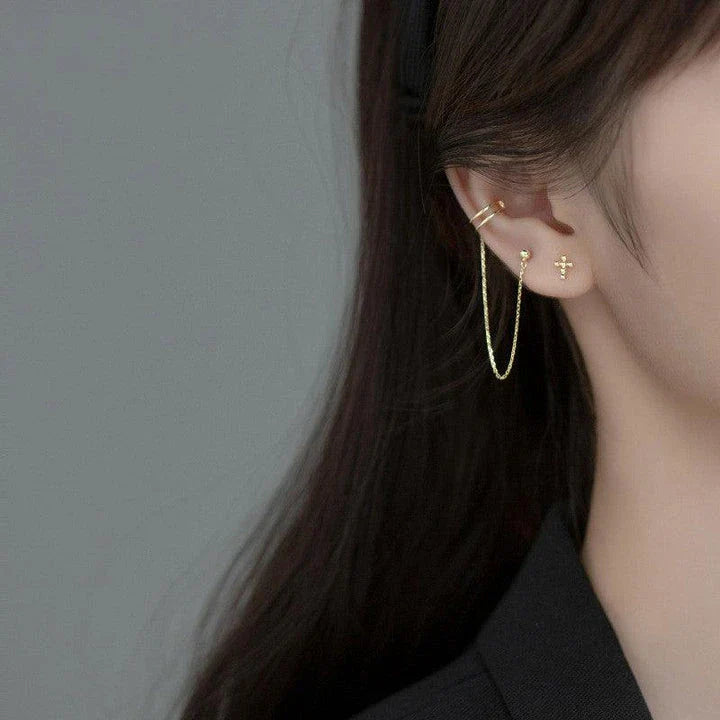 Asymmetric sterling silver one-piece earring and ear clip set with a modern and distinctive design