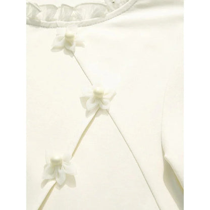 Elegant floral short sleeve t-shirt with wooden ear side detail, perfect for chic British summer style