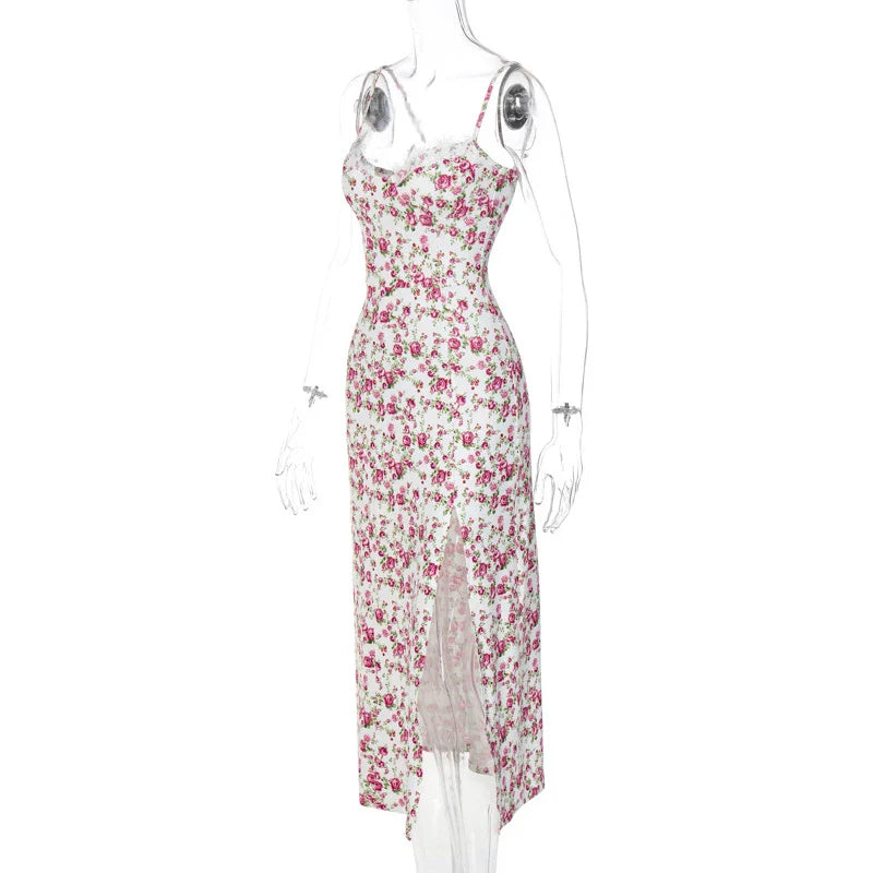 Elegant floral midi dress with slit, adjustable suspender straps, and luxurious polyester fabric for a sophisticated summer look.