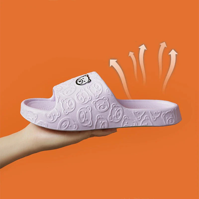 Cosy bear paw slippers in purple colour with soft, plush lining for relaxing indoor wear