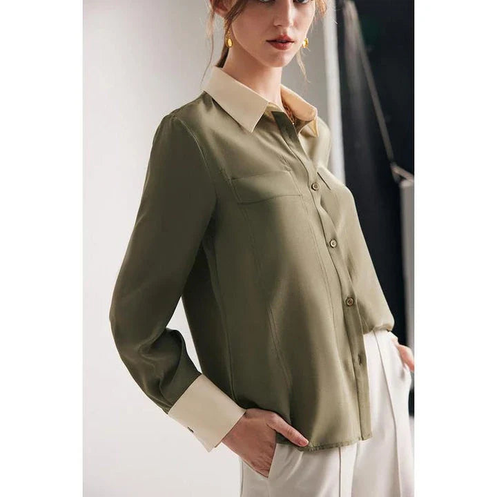 A chic and elegant silk crepe de chine blouse in a timeless solid pattern, perfect for professional and casual wear.