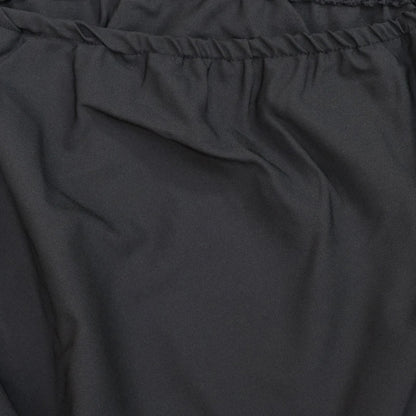 Elegant two-piece set with oblique shoulder blouse and midi skirt in black colour