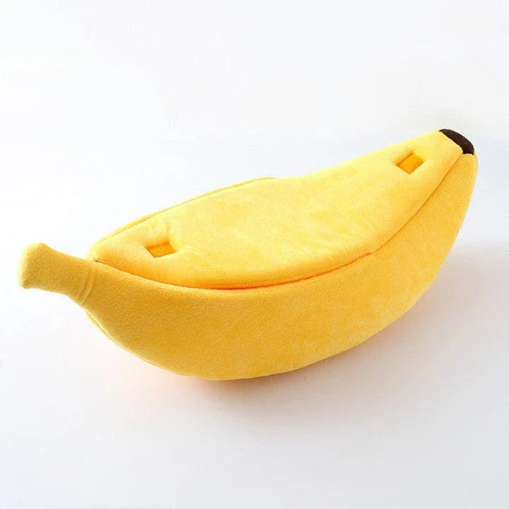 A cosy, banana-shaped cat bed made of plush, supportive materials in various vibrant colours to provide a comfortable and stylish retreat for feline friends.