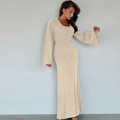 Elegant U-neck dress with lace-up back and flowing bell sleeves in a variety of sophisticated colours