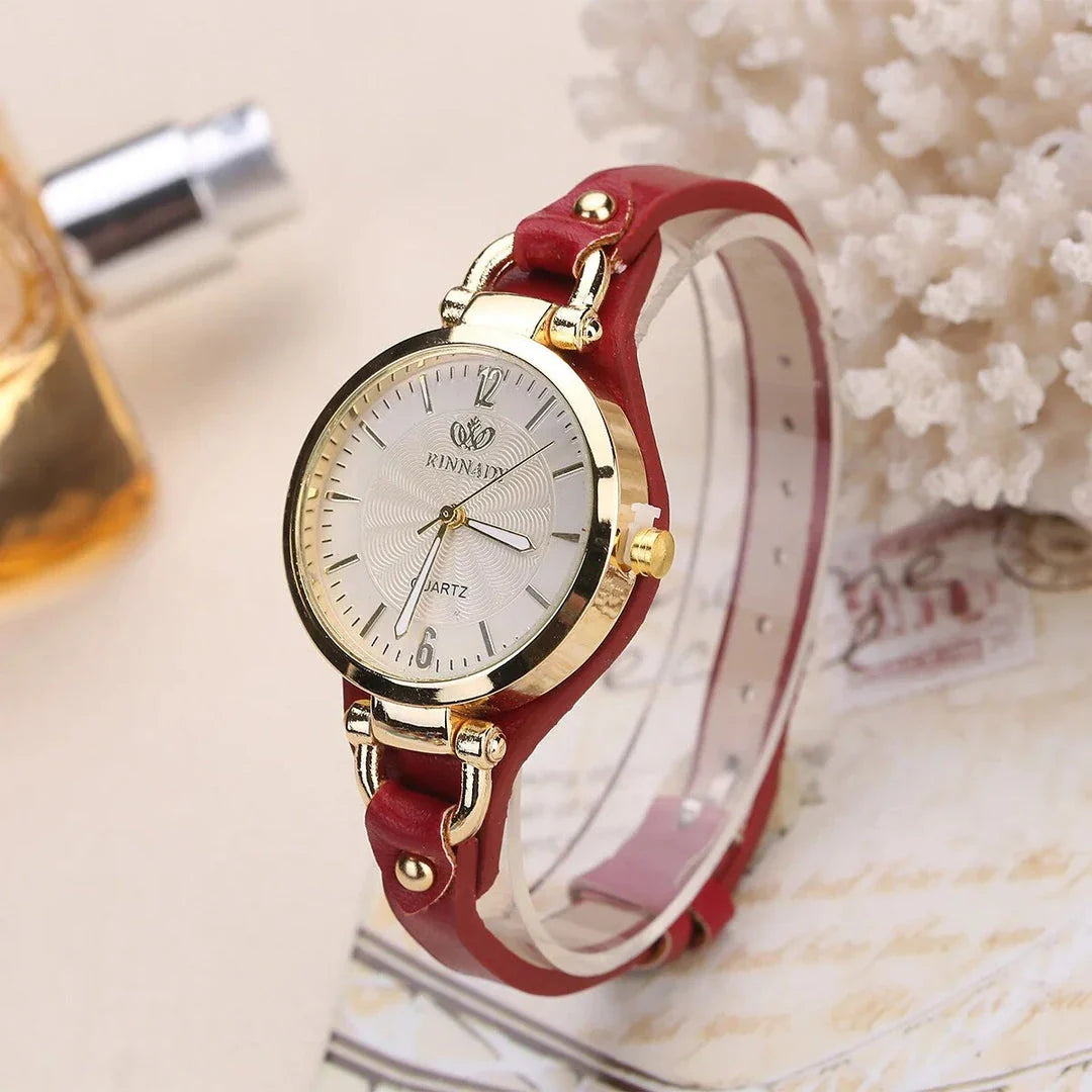 Elegant women's quartz watch with a black leather strap, featuring a sleek alloy case and a durable glass dial window