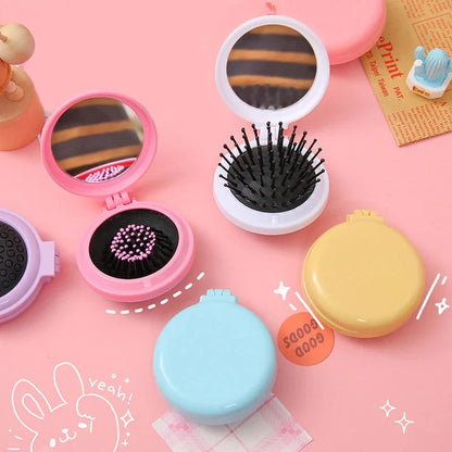 Portable folding hair comb with mirror, featuring a dual-sided design with a round mirror and eco-friendly hairbrush for on-the-go styling and grooming