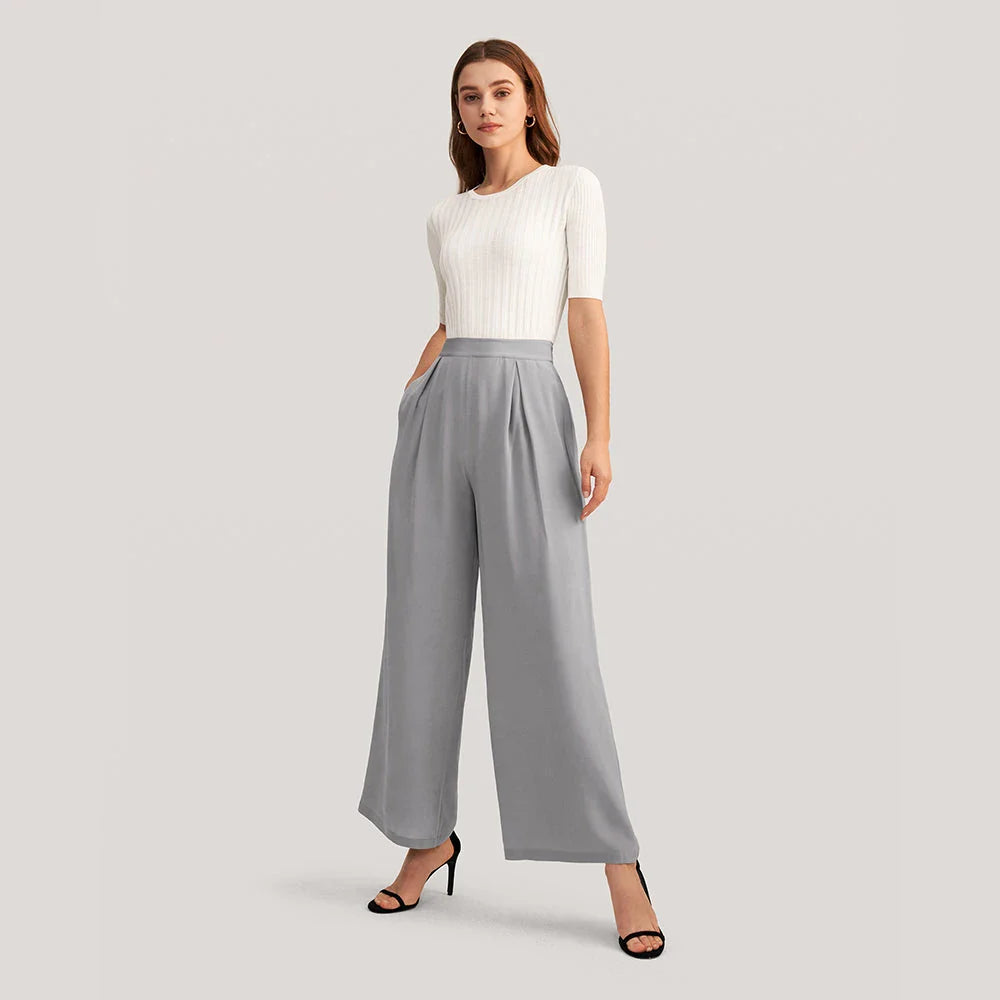 Chic silk wide-leg trousers in a sophisticated grey colour, featuring a high-waist design and relaxed fit for all-day comfort and style.