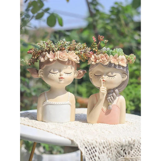 A charming 7.8-inch resin planter in the shape of a fairy girl, perfect for displaying succulents and adding whimsical decor to your home or office.