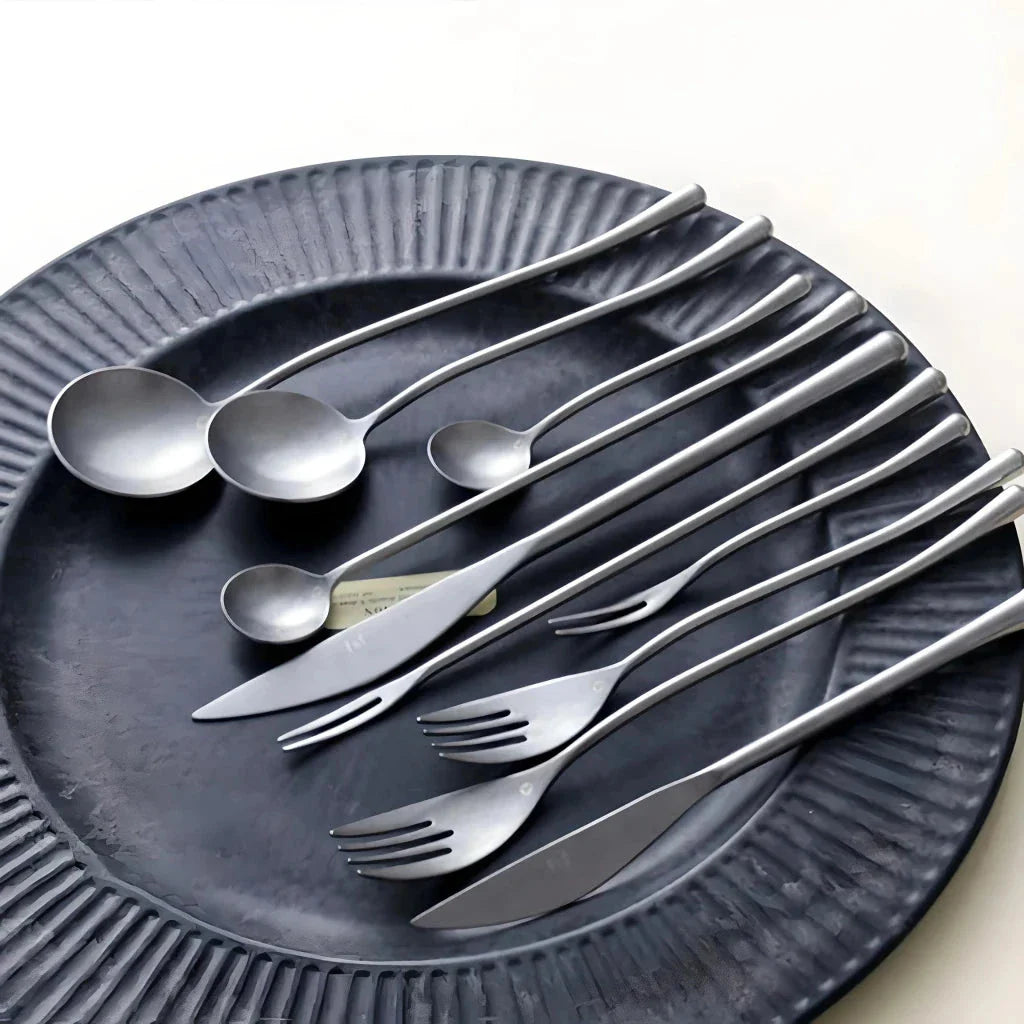 Elegant retro stainless steel cutlery set with sleek silver finish and solid pattern for sophisticated British dining