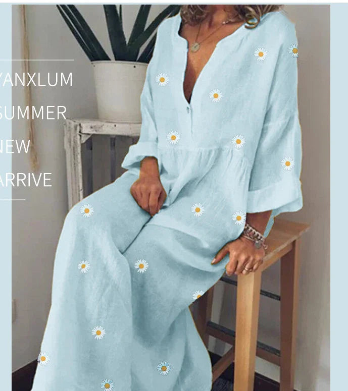 A stylish and comfortable loose dress featuring a charming daisy print and long sleeves, perfect for various occasions.
