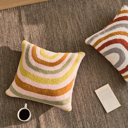 Bohemian-inspired microfibre cushion cover in light pink and white with a cosy, fuzzy texture