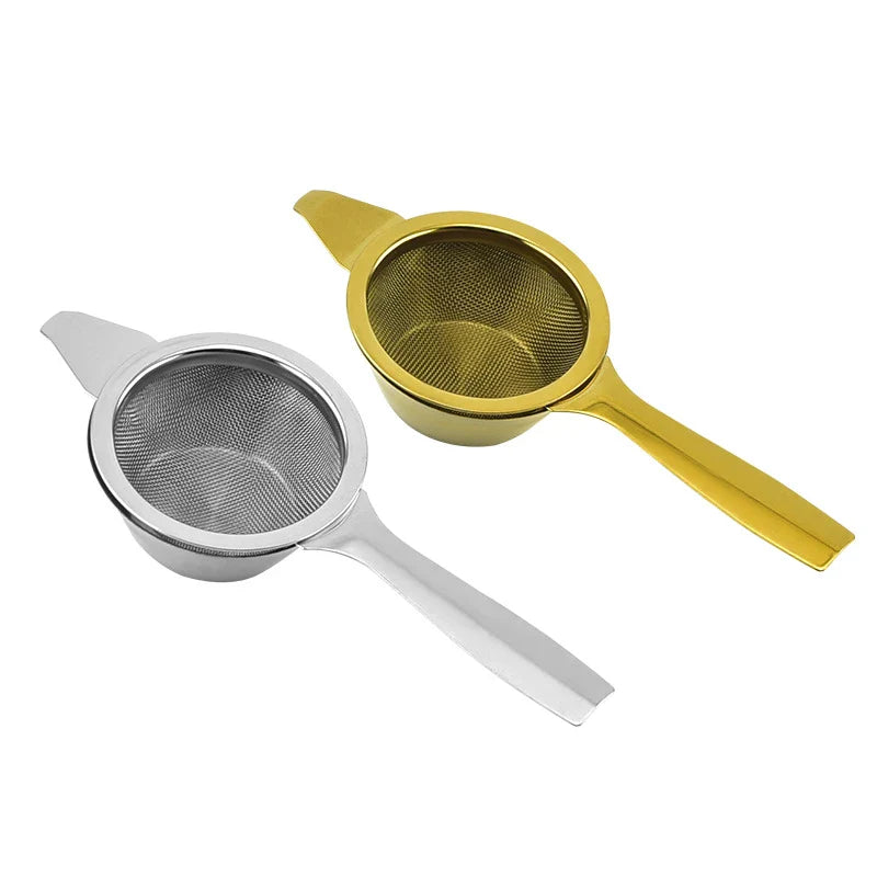 Stainless steel tea infusers with gold-tone finish in a modern, minimalist design