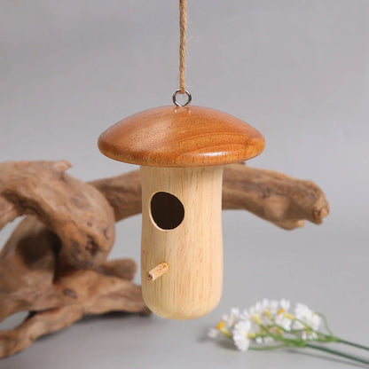 A charming wooden hummingbird nest designed for outdoor gardens, providing a safe and cozy home for these delightful birds.