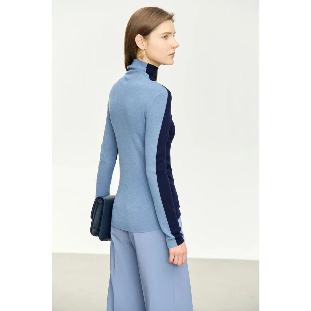 A cosy and stylish turtleneck sweater with a unique patchwork design, made from a premium wool blend for exceptional comfort and elegance.