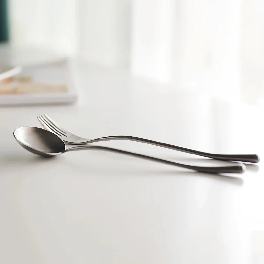 Elegant retro stainless steel cutlery set with sleek silver finish and solid pattern for sophisticated British dining