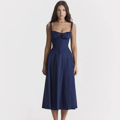 Elegant backless midi sundress in blue, featuring a stylish high split and mid-calf length for a sophisticated summer look.