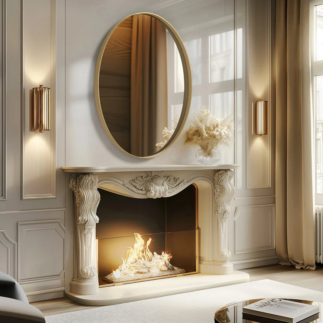 Elegant oval gold wall mirror with a contemporary decorative brushed gold frame