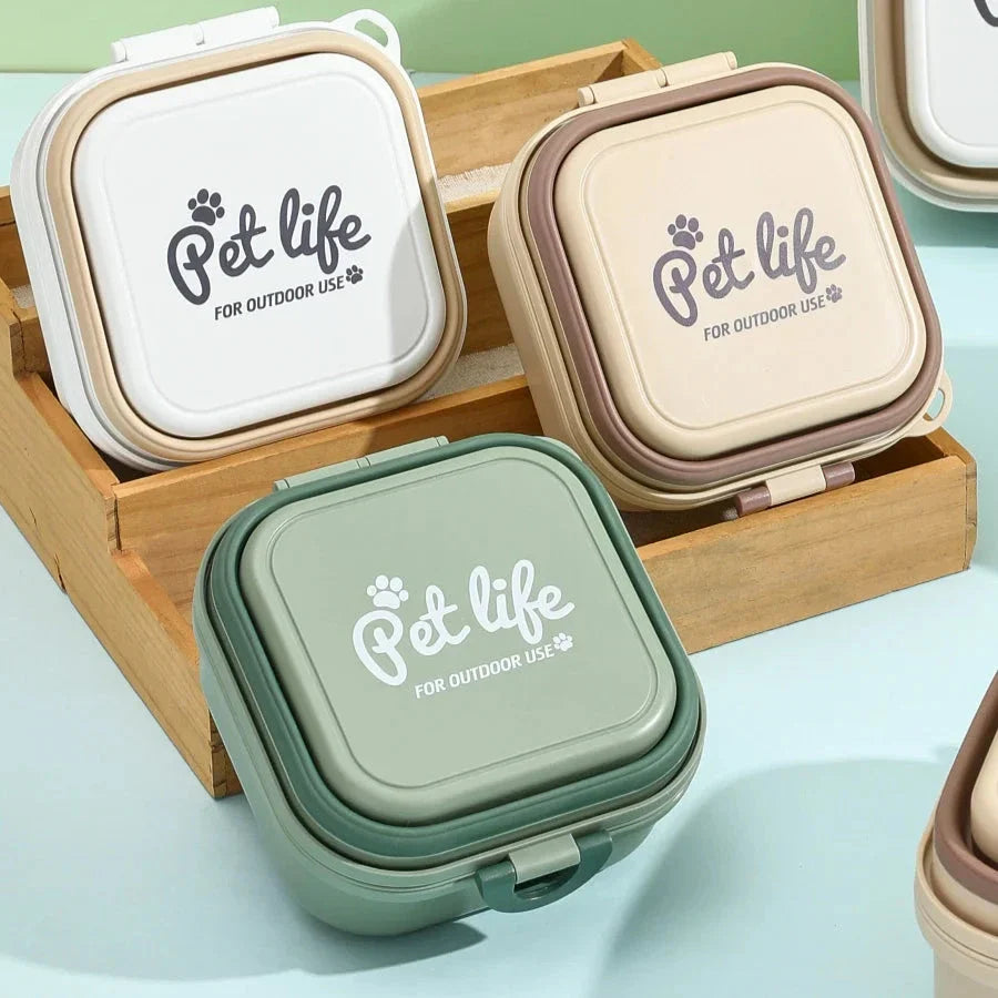 Portable double-decker foldable travel bowl for dogs and cats, featuring separate compartments for food and water, durable plastic construction, and a compact, collapsible design for easy transport.