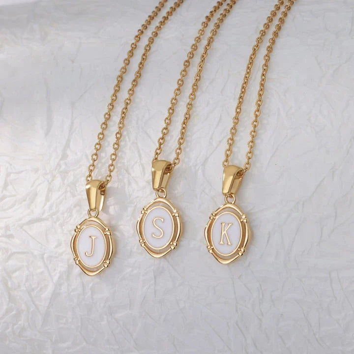 Elegant gold-tone letter pendant necklace with innovative drip oil design and integrated fitness tracker