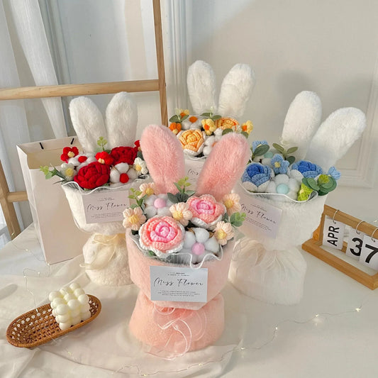 A delightful knitted rabbit bouquet doll in vibrant colours, featuring soft plush materials and a charming design