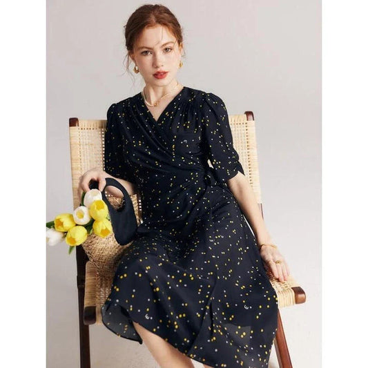 Elegant black polka dot silk wrap dress with V-neck and empire waistline, perfect for formal and casual occasions