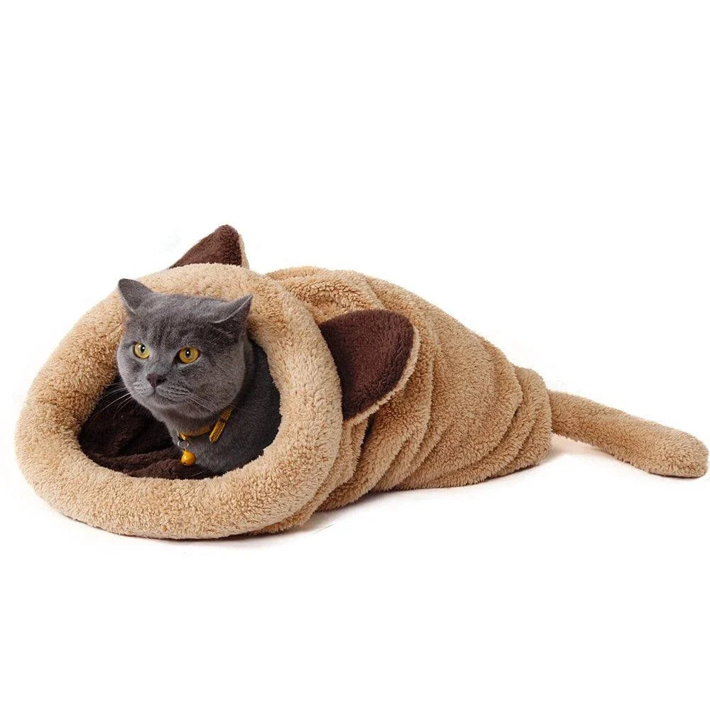 Cosy cat-shaped sleeping bag made of plush polyester material, providing a comfortable and relaxing retreat for your feline friend.