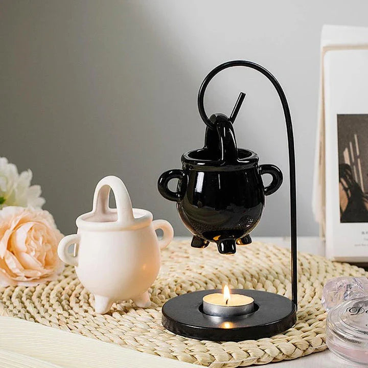 Captivating iron frame essential oil diffuser and candle holder with a unique witch's soup cup design