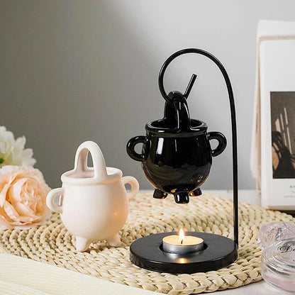 Captivating iron frame essential oil diffuser and candle holder with a unique witch's soup cup design