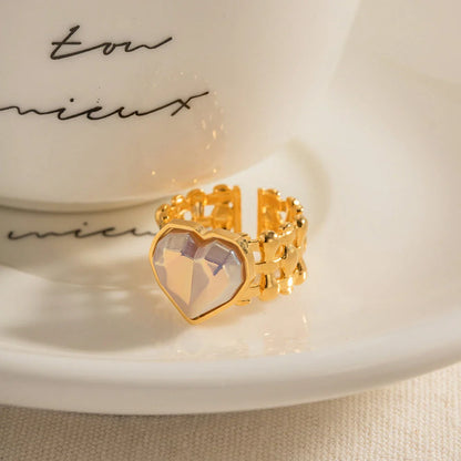 Adjustable stainless steel ring with a mermaid-inspired heart design and shell beads, a unique and versatile accessory.